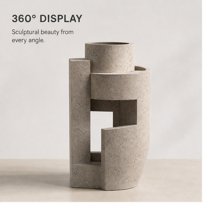 PLIOXOO® concrete vase 360° display – sculptural beauty from every angle, showing front-angle view of geometric form with curved cutout and angular terraces