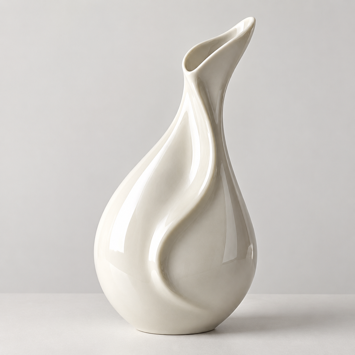 PLIOXOO® fluid swirl ceramic vase – clean white sculptural design on neutral background, full product view