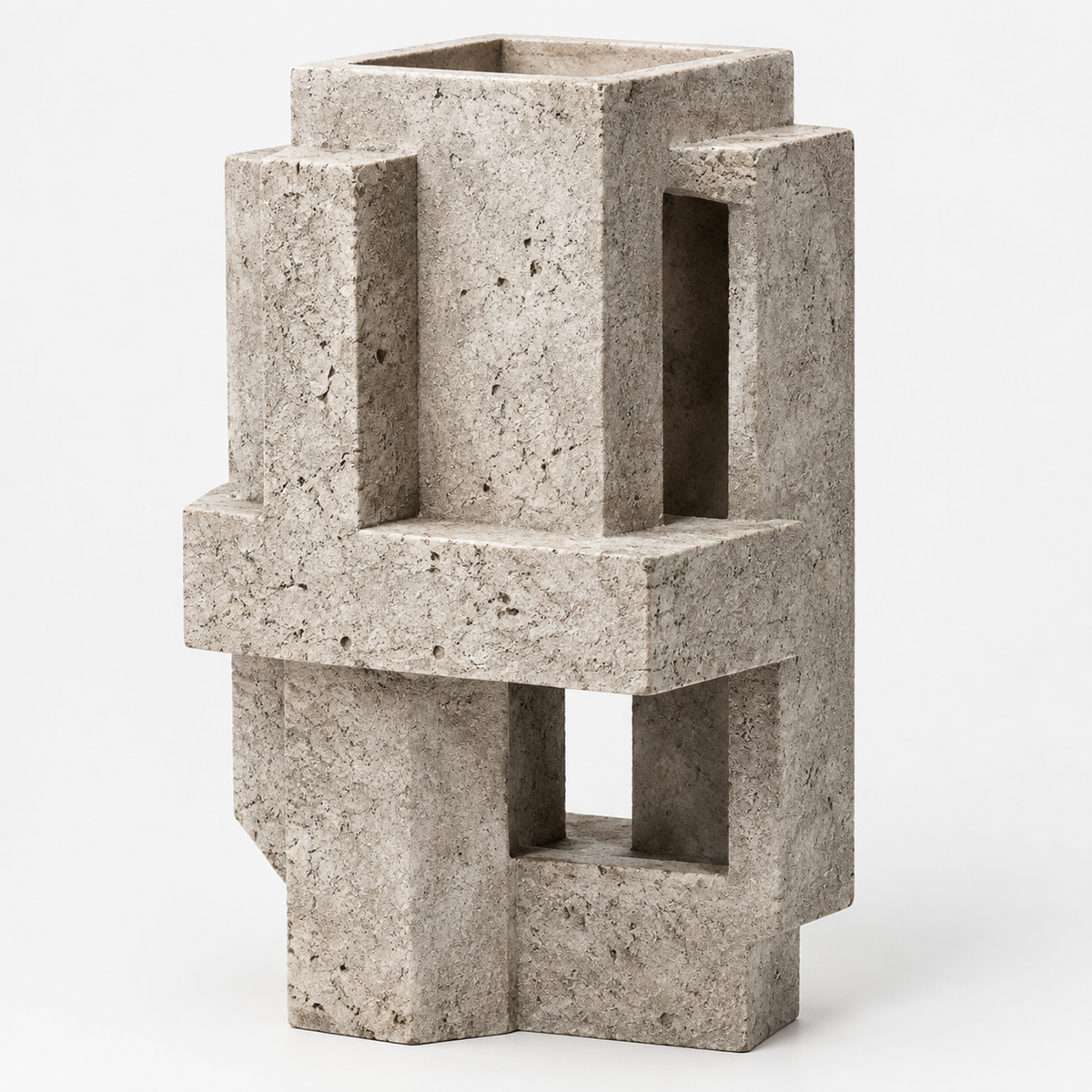 PLIOXOO® concrete geometric block vase on white surface – full product view showing four interlocking rectangular columns with open windows and cruciform base in speckled grey concrete
